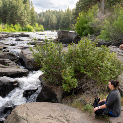 Meditating by the river at the Bend Yoga Festival